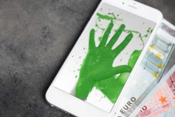 Wir kaufen Dein Handy: Handy mit grüner DEINHANDY-Handy, dahinter Geldscheine